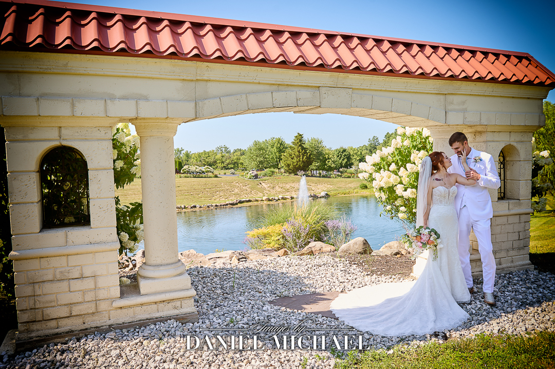 Couple standing near lake entrance